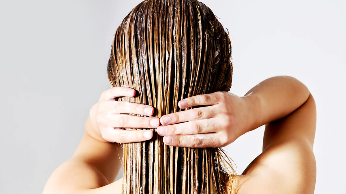 women conditioning hair