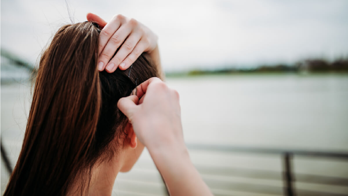 putting bobby pins into hair