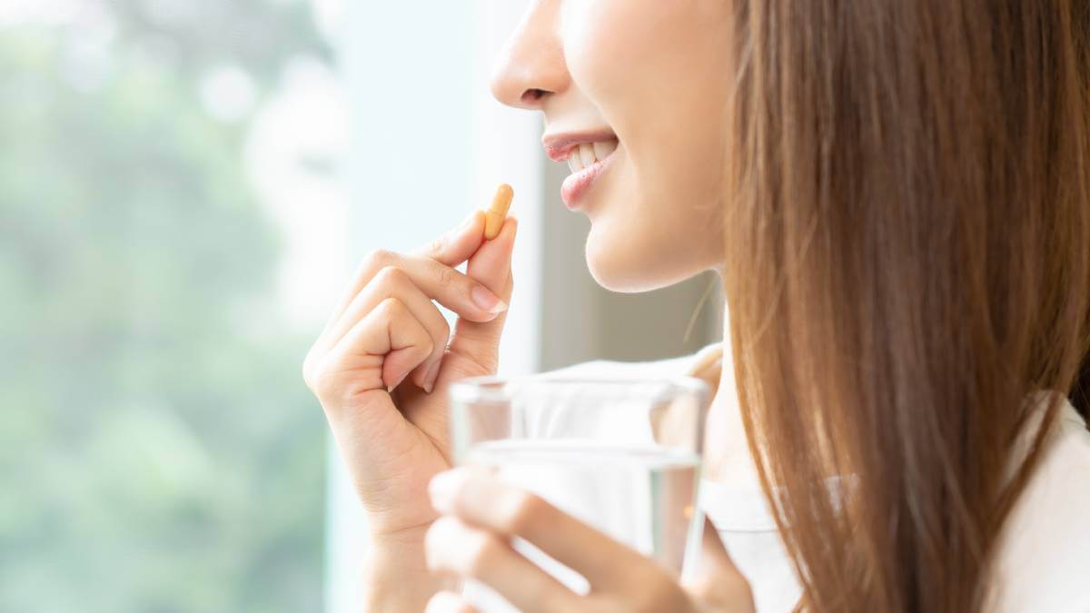 Lady Taking Supplement