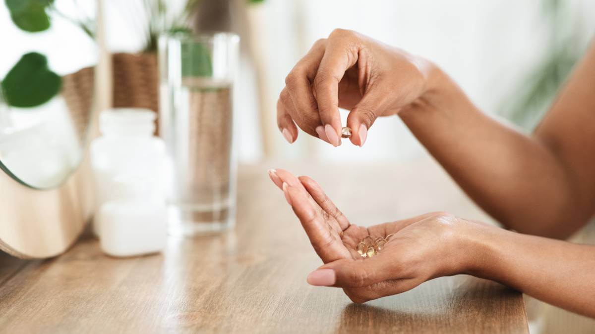 Woman Holding Supplements